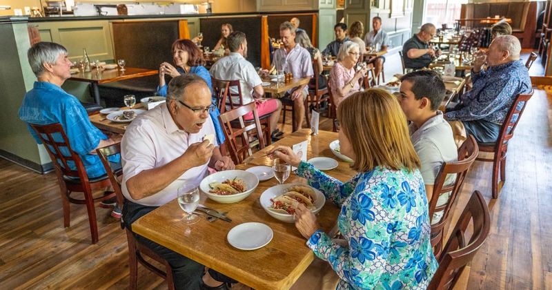 Interior, guests enjoying food and drinks
