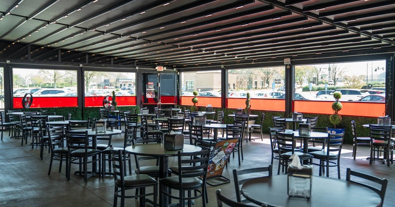 Covered patio with tables and chairs
