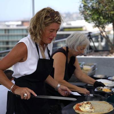 Owner Isabelle preparing crepes