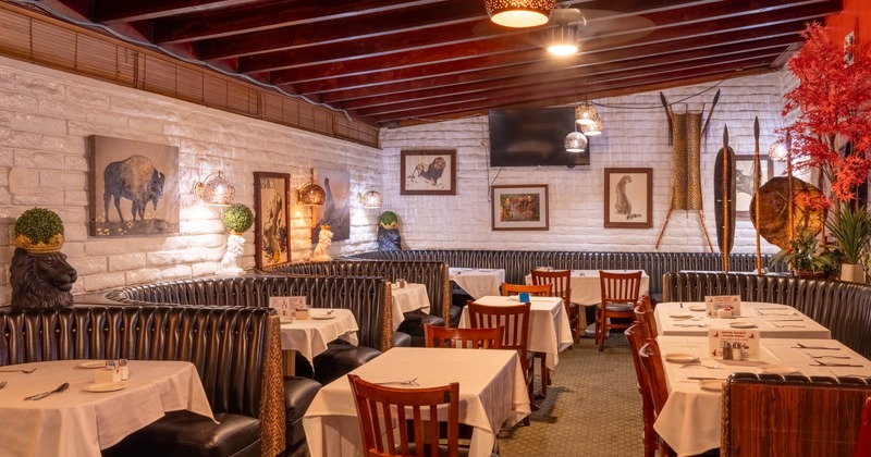 Interior, dining area, seating booths and regular dining tables for two, ready for guests