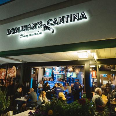 Exterior  at night , guests enjoying drinks