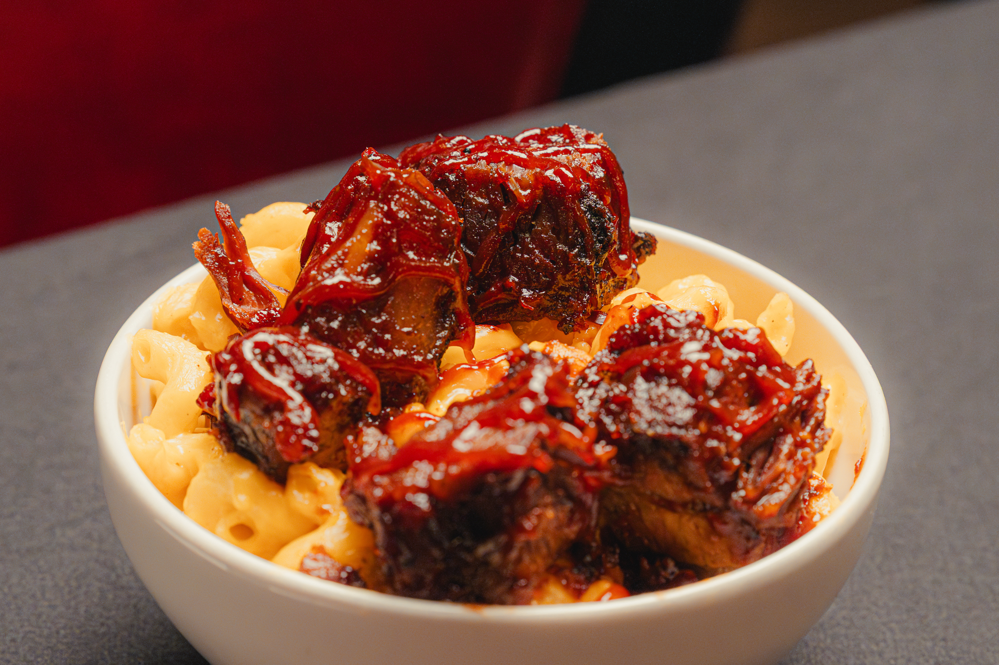 Burnt ends served over mac n’ cheese