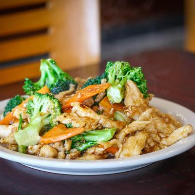 Stir fried chicken in brown sauce, with broccoli and carrots.