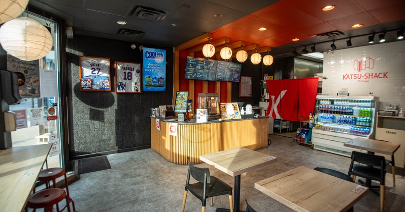 Interior, tables and chairs with counter in the back