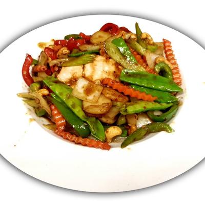 Salmon filet topped with stir fried carrots, celery, onions, garlic, cashews and snow peas.