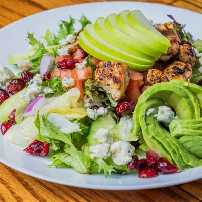 Grilled chicken salad, with apples, tomato, cranberries, blue cheese, and avocado.