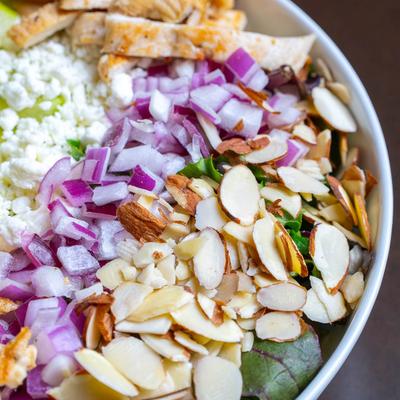 Chicken, apple and goat cheese salad, closeup.