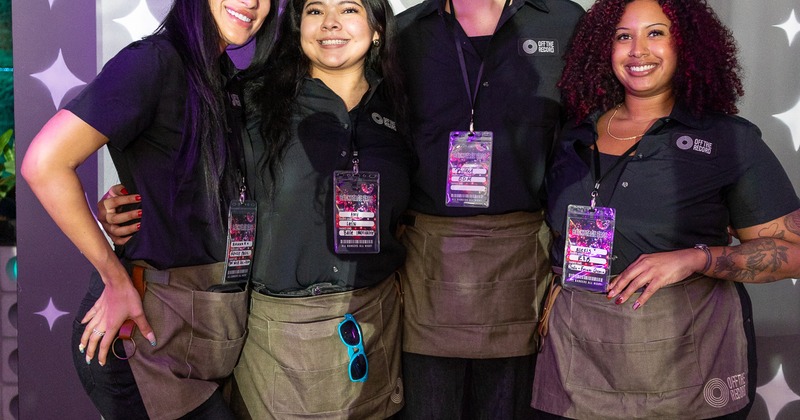 Four staff members posing together