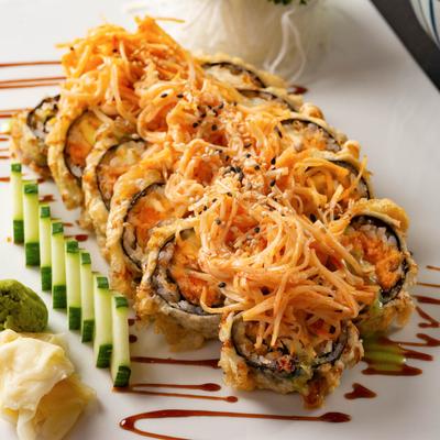 Deep fried spicy salmon sushi rolls topped with spicy crab salad.