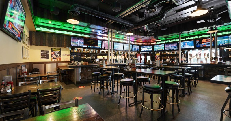 Interior, tables, chairs, booths, windows, LED screens, lights, ventilation system