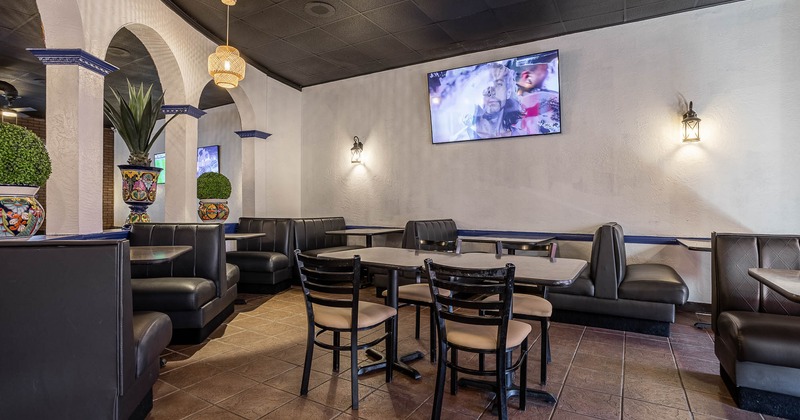Interior, spacious seating area with TV on the wall