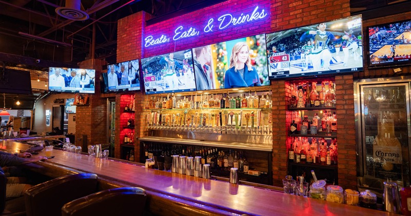 Bar, tv's above the drinks shelf