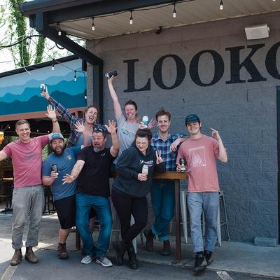 Group of people posing in front of the brewery.