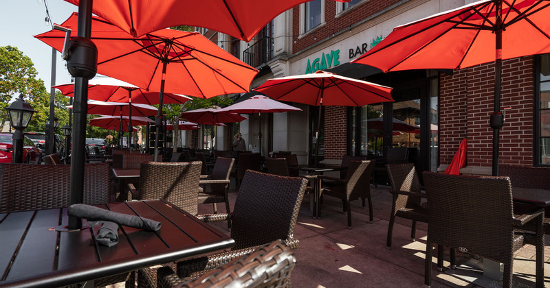 Outside seating area with red restaurant umbrellas