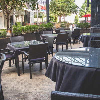 Restaurant exterior, tables outside ready for guests