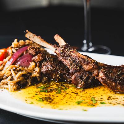 Roasted lamb chops with rice.