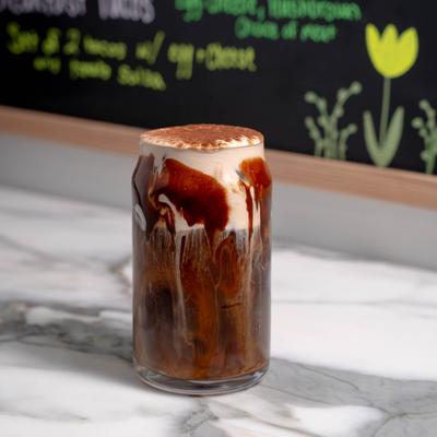 Chocolate cream cold brew dusted with cocoa powder.