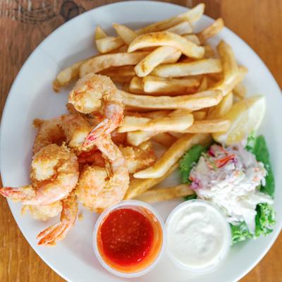 Fried shrimp, with coleslaw, fries, and dipping sauces.
