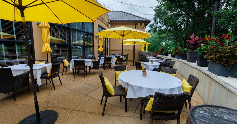 Outdoor, seating area with tables and chairs