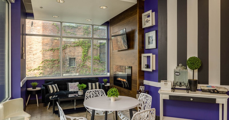 Interior, separated seating area with couch, table for four, various decorations