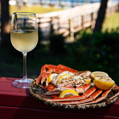 Crab legs and glass of wine.