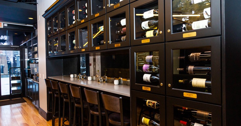Interior, wine racks with a counter and chairs