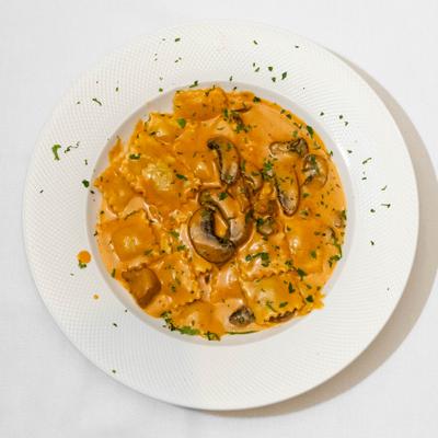 Ravioli special with mushroom wine sauce, top view.