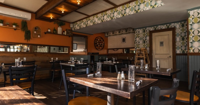 Interior, dining tables ready for guests