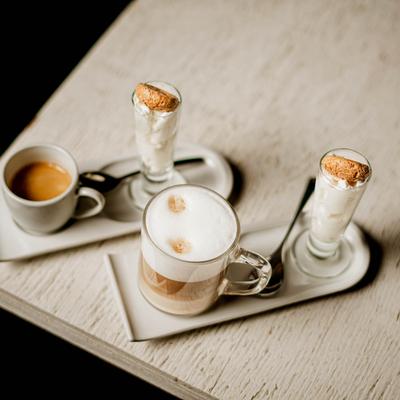 Latte and espresso served on a table.