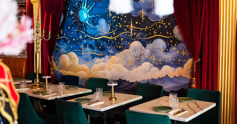 Interior, dining area with fairytale theme painted wall