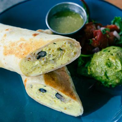 Breakfast Burrito with salsa verde, pico de gallo,  and guacamole.