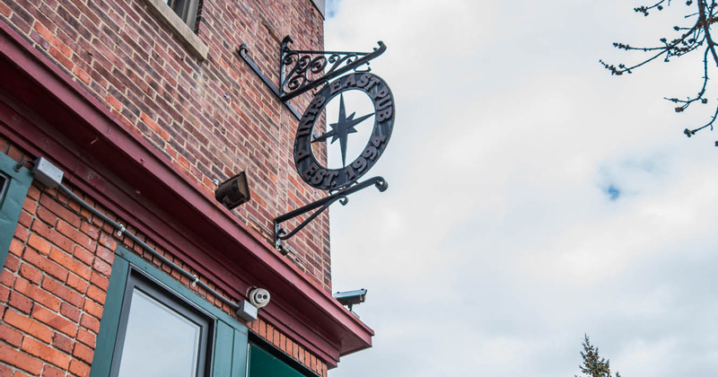 Points East Pub metal sign in front