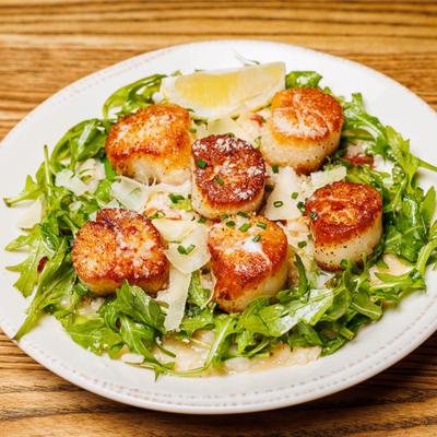 Pan seared Scallops with risotto, arugula, and parmesan.