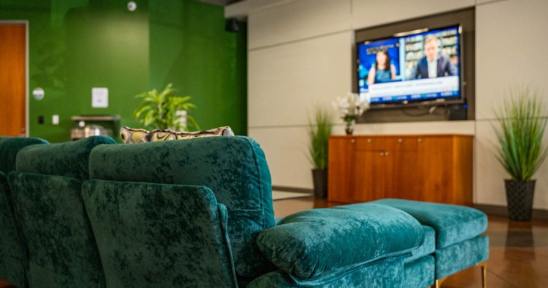 Interior, cozy couch in front of a  TV screen