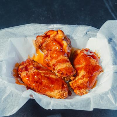 Chicken wings, served on the table.