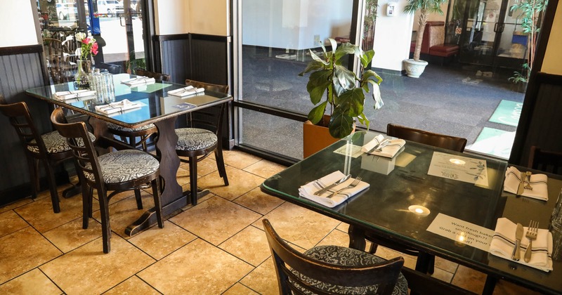Interior, dining tables ready for guests