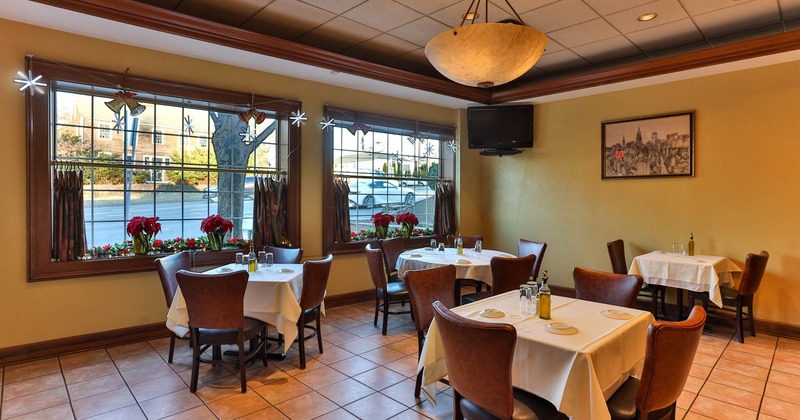 Interior, dining area, tables and chairs ready for guests, windows, street view