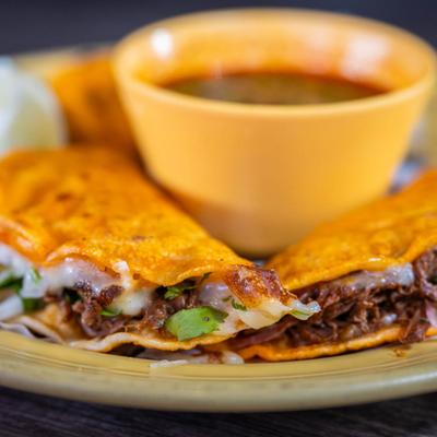 Close-up of quesabirria tacos.