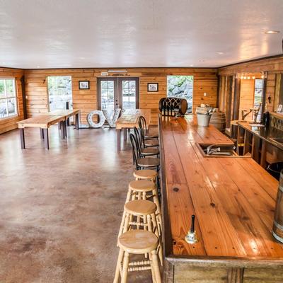 Bar area with tables in the back