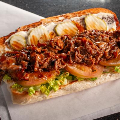 Pastrami sandwich with chili sauce.