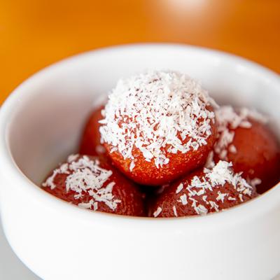 Fried dough balls soaked in a sweet, sticky suryp.