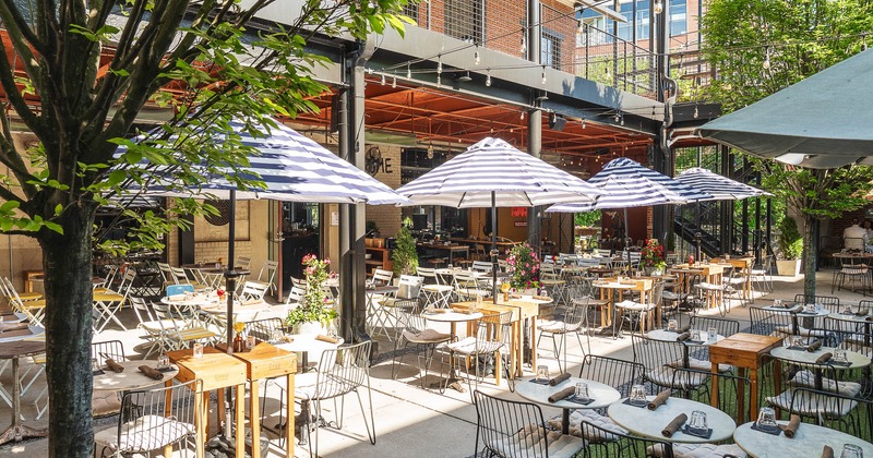 Exterior, patio with tables, chairs and parasols