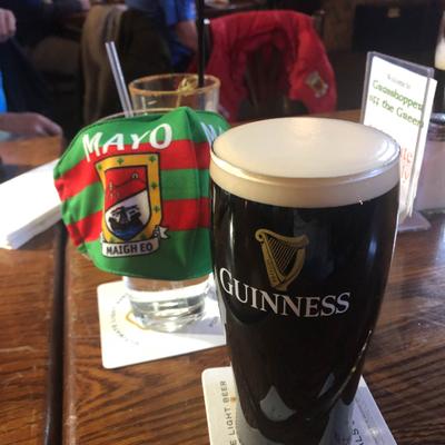 Pint of dark beer, close view.