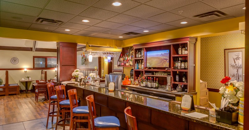 Bar, chairs, tv behind a bar