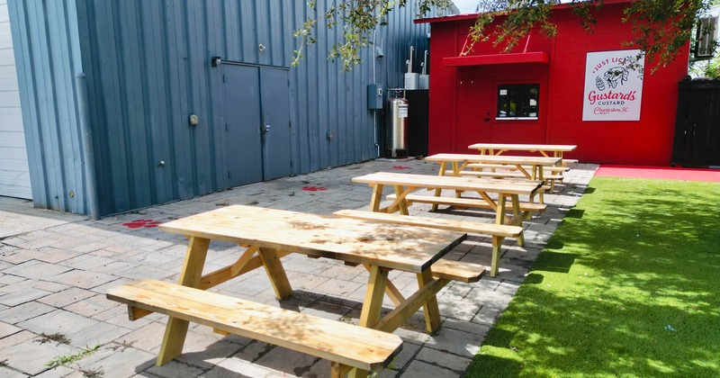 Exterior, conjoined wooden tables and benches