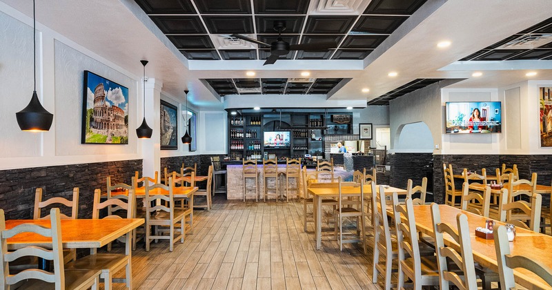 Interior, main dining area with bar in the back