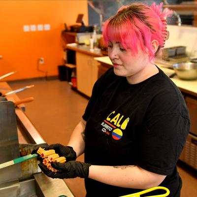 An employee with churros.