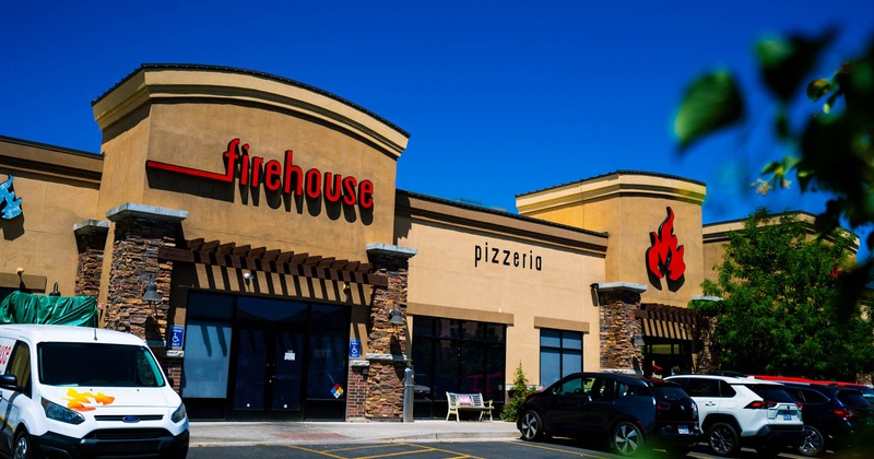 Firehouse Pizzeria building and parking lot on a sunny day