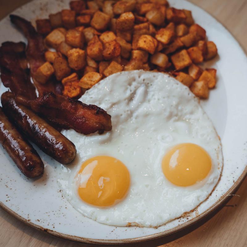 2 Eggs, Bacon or Sausage, Fruit or Hashbrowns, Toast or Mini-Stack photo