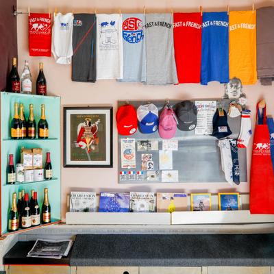 Interior, an assortment of uniforms, magazines and wine bottles